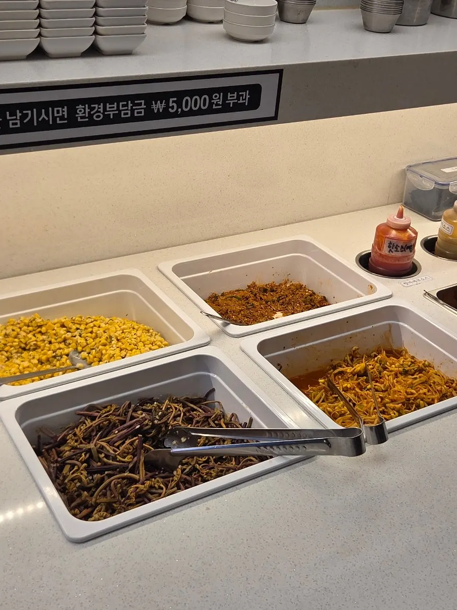 Rice cakes and side items at the self-serve corner