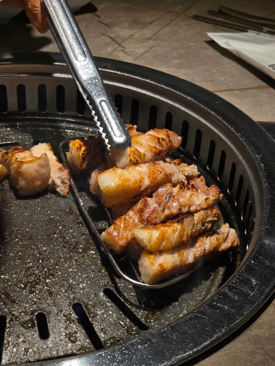 Ogyeopsal and samgyeopsal grilling on the pan