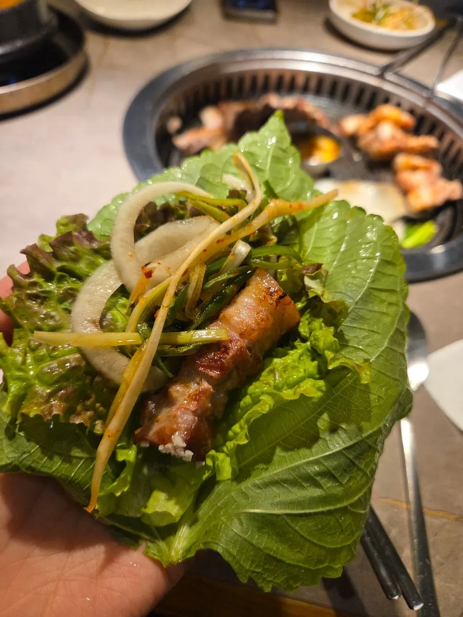 A piece of pork belly dipped in salt