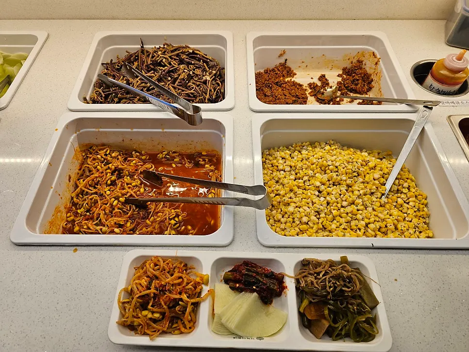 Various sauces displayed on the self-serve bar