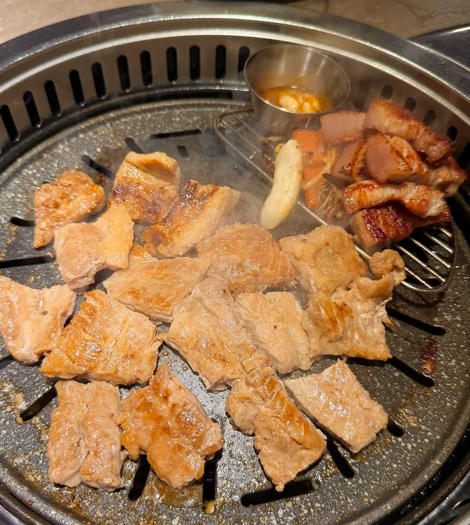 Pork belly and side ingredients on the grill
