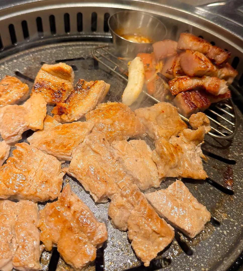 A perilla leaf wrap with jjolmyeon and pork belly