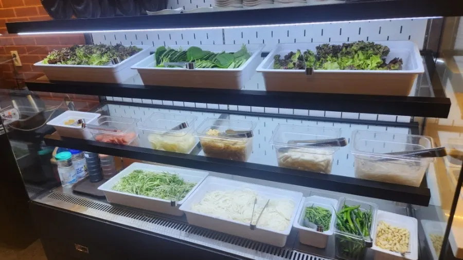 Grilling extras and sauce corner at the self-serve bar