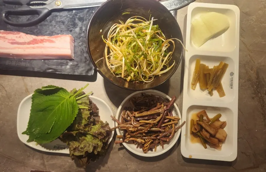 A plate of bracken and other self-served side dishes