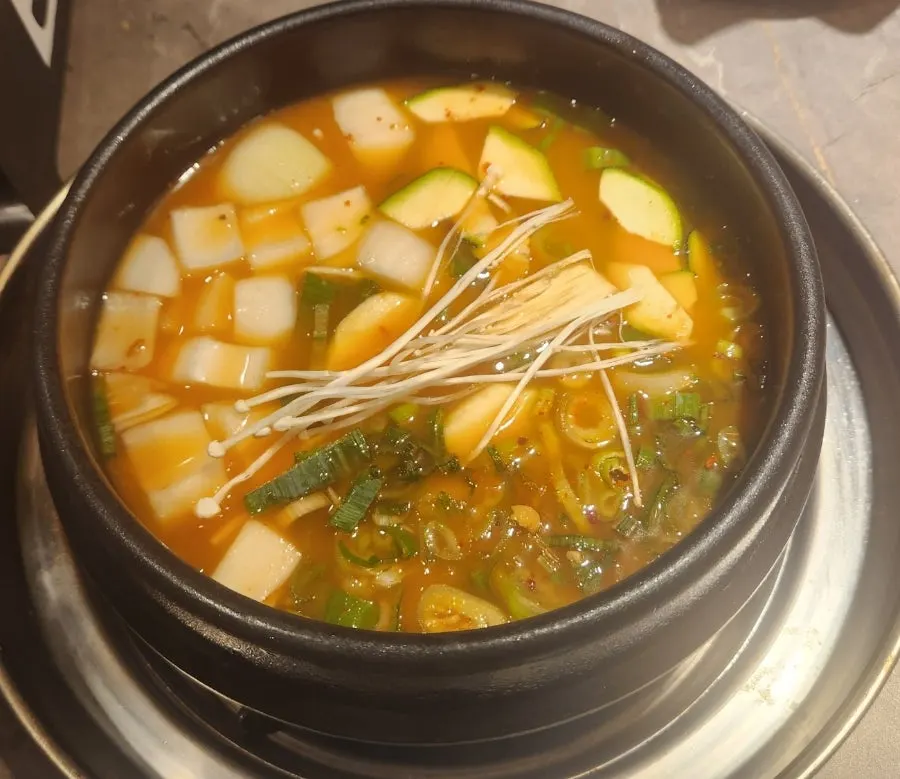 A spread of doenjang-jjigae and stone pot rice