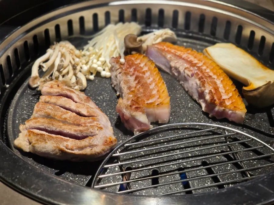 Meat from the couple set grilling on the grill