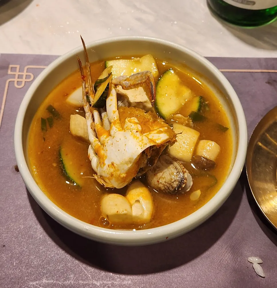 Seafood doenjang-jjigae in a cast-iron pan