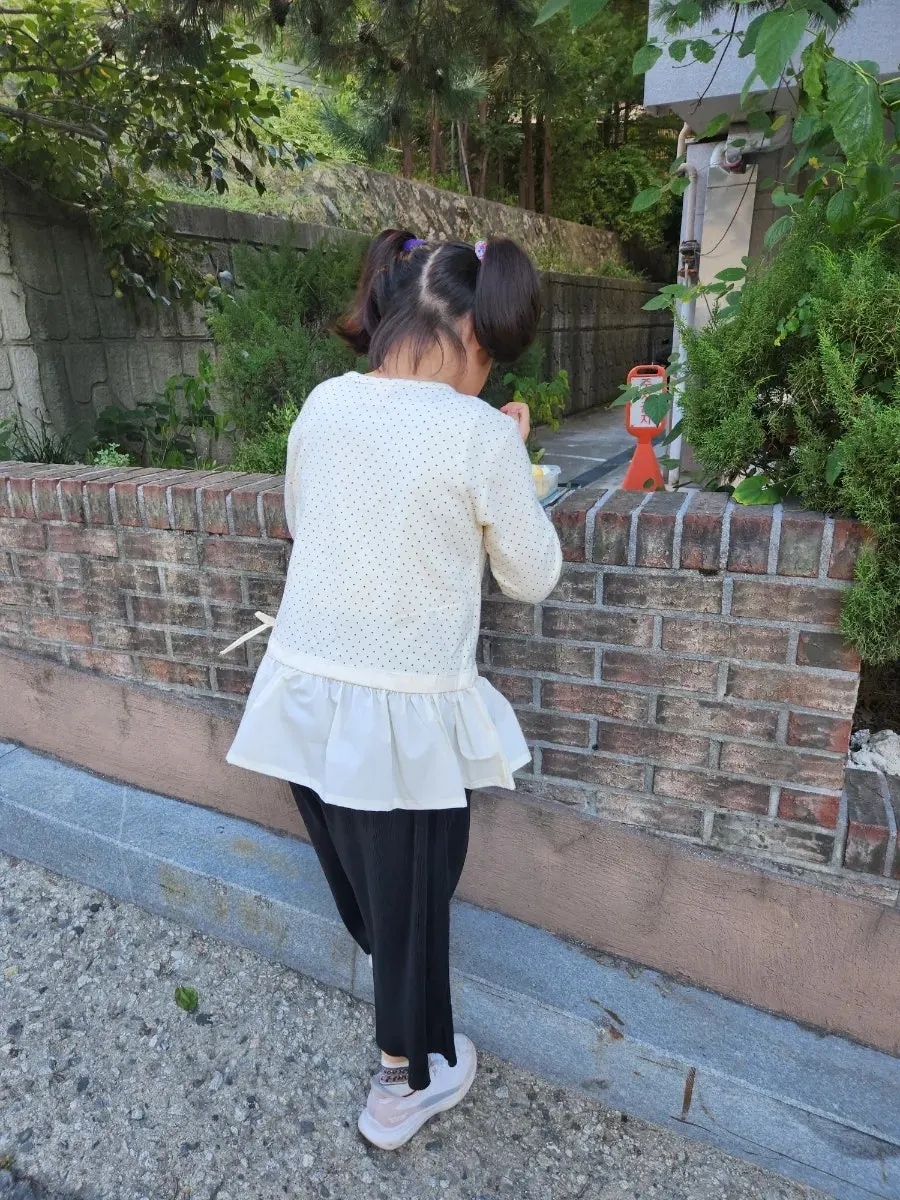 A girls' frilly top with frill detailing