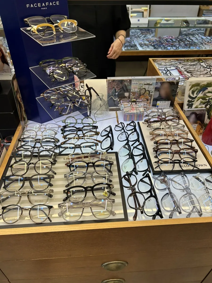 Frames displayed floor to ceiling on the wall