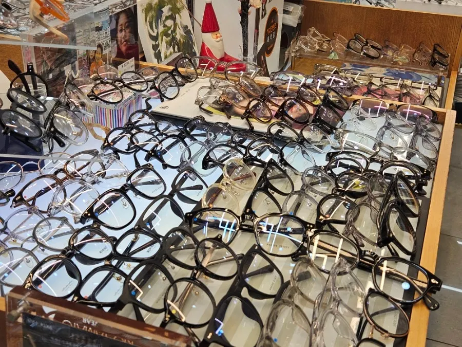Round and square eyeglass frames on display