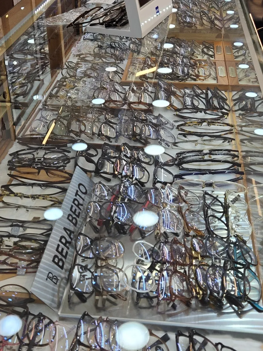 Tall vertical display case of eyeglass frames