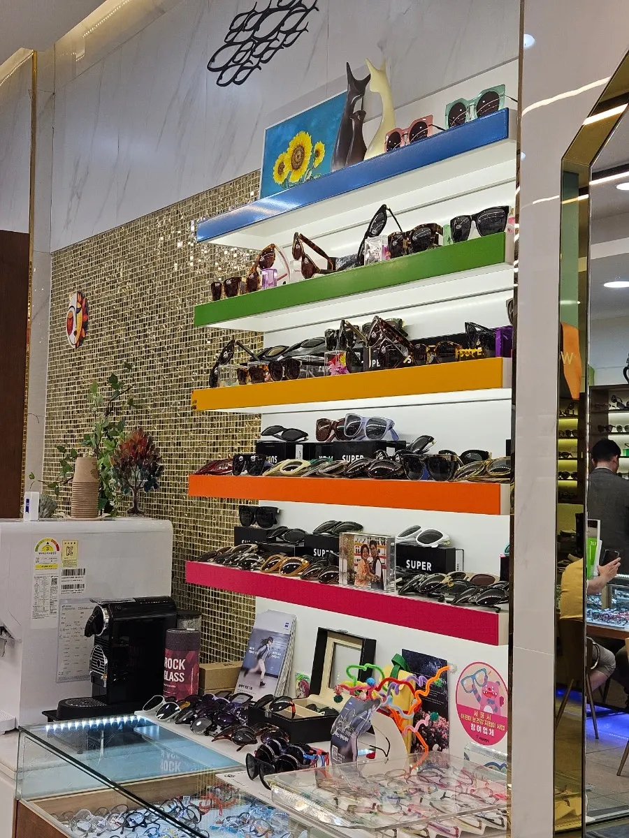 Sunglasses display wall on one side of the store
