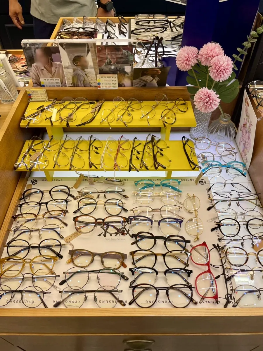 Trying on several different glasses designs