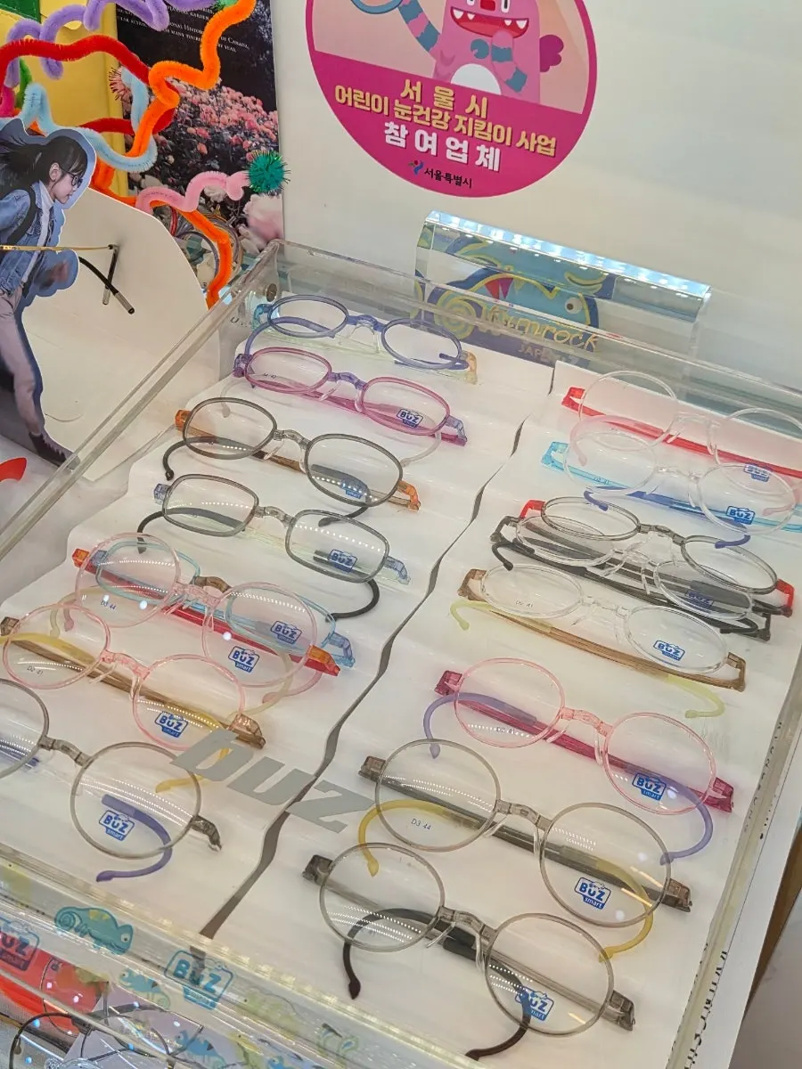 Space in front of the wall hung with eyewear frames