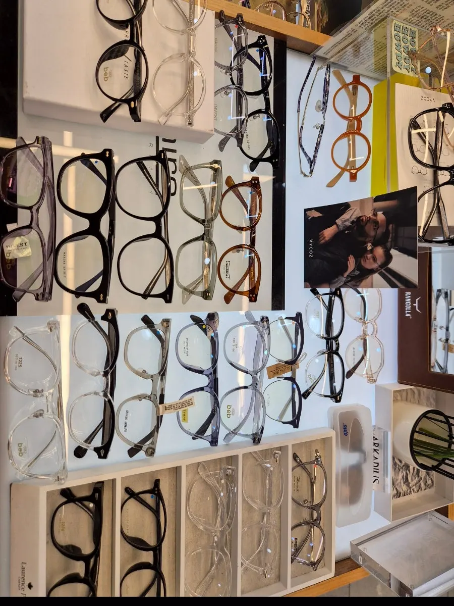 A row of sunglasses mixing metal and horn-rimmed frames