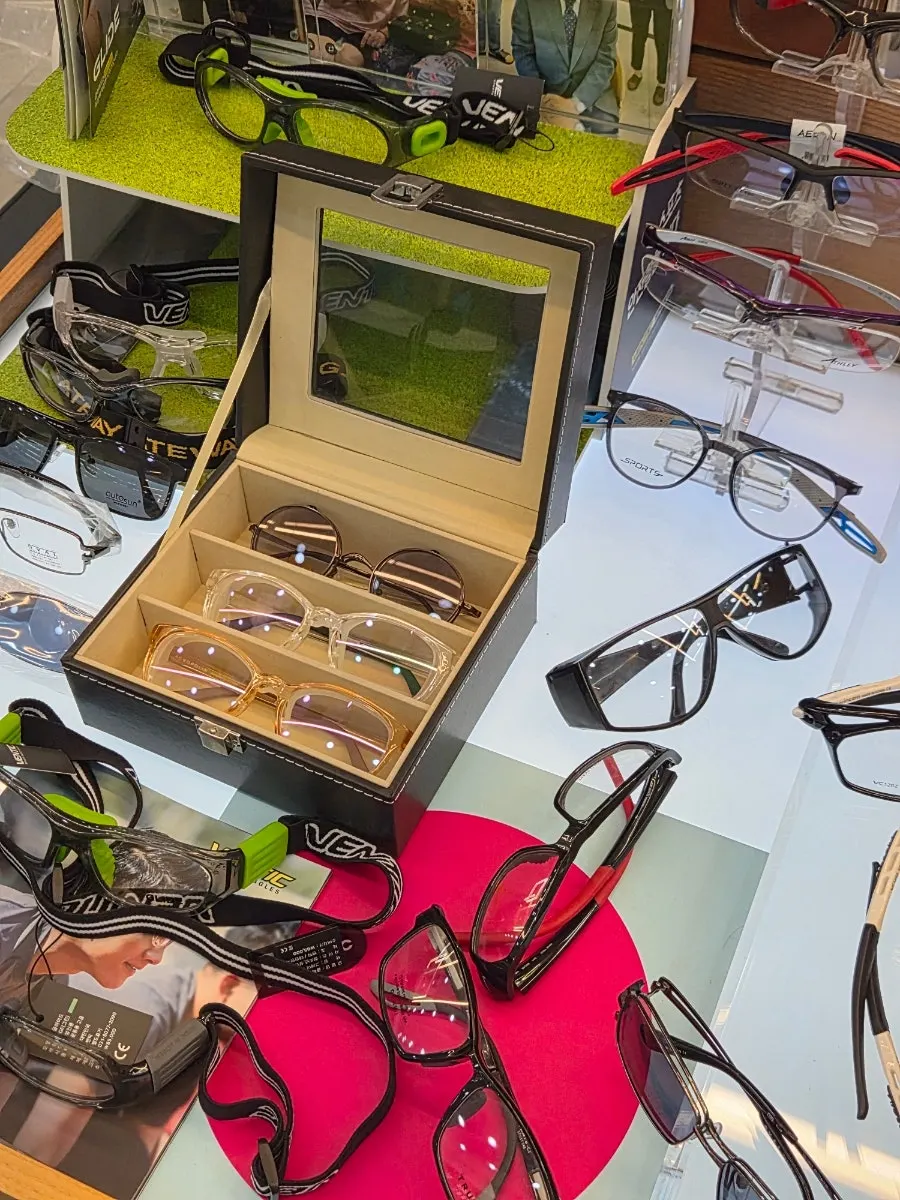 Display shelf holding clear-frame sunglasses