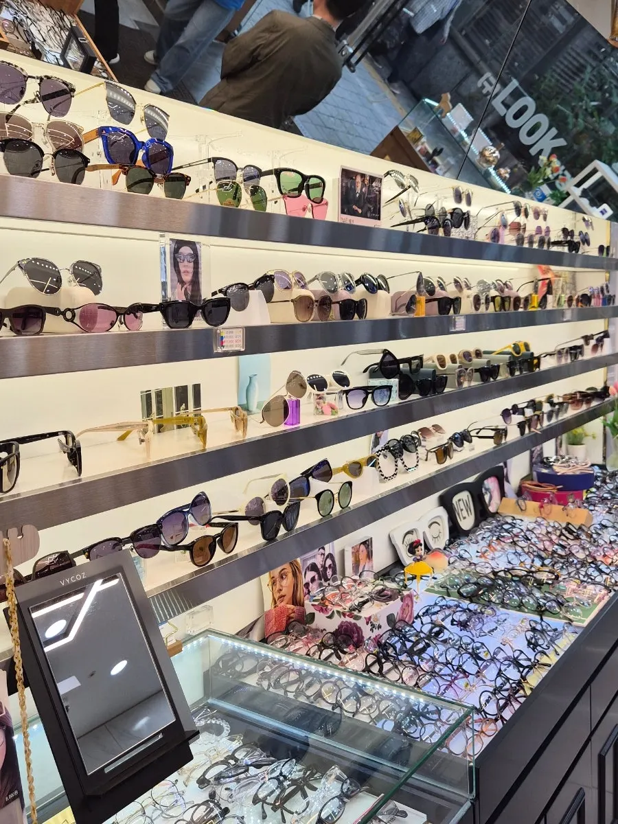 Wall of sunglasses easy to scan up and down while comparing