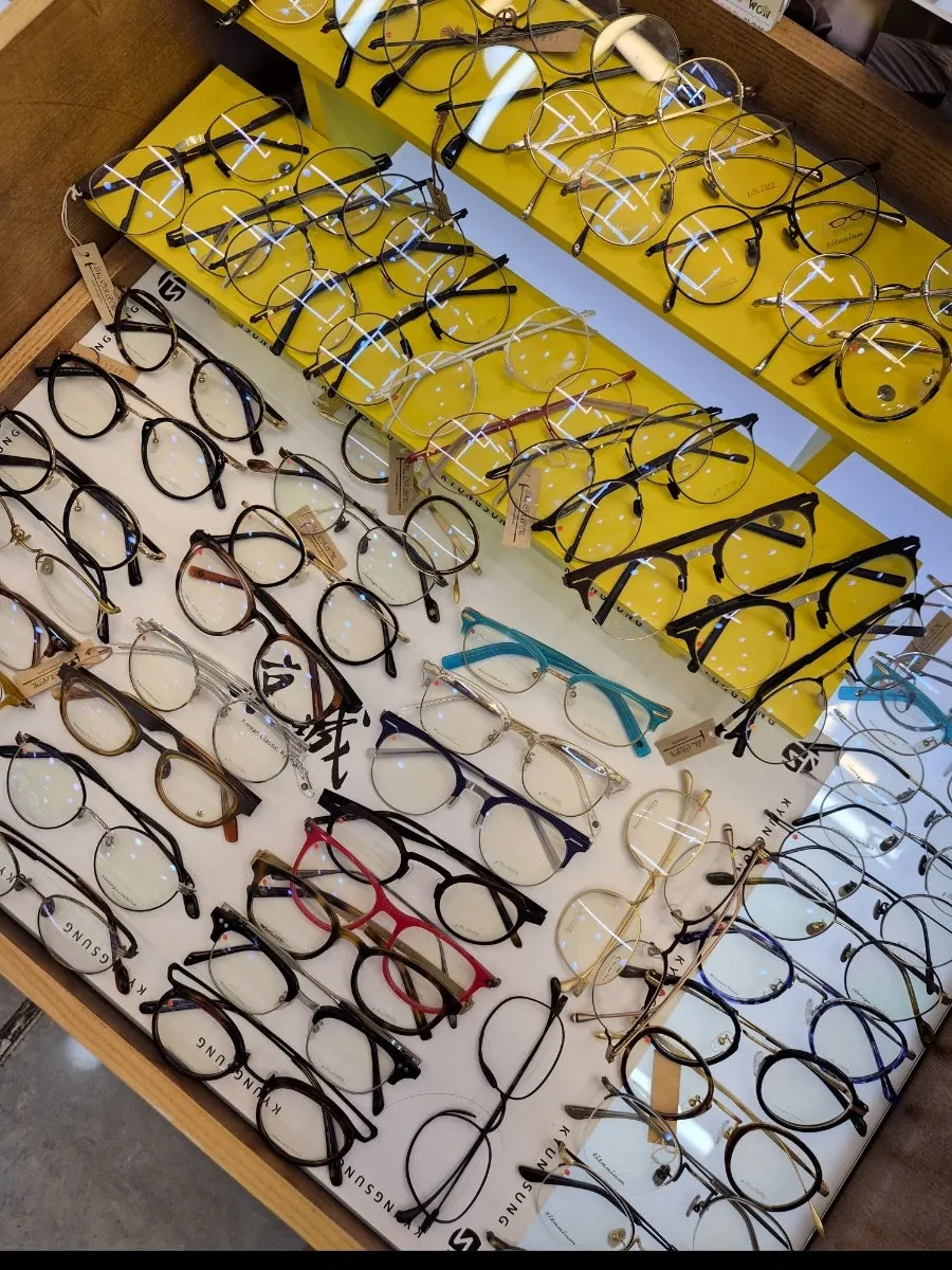 Checking the lens color of the clear-frame sunglasses