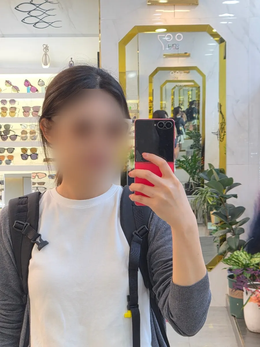 Beige clear-frame sunglasses picked up after fitting