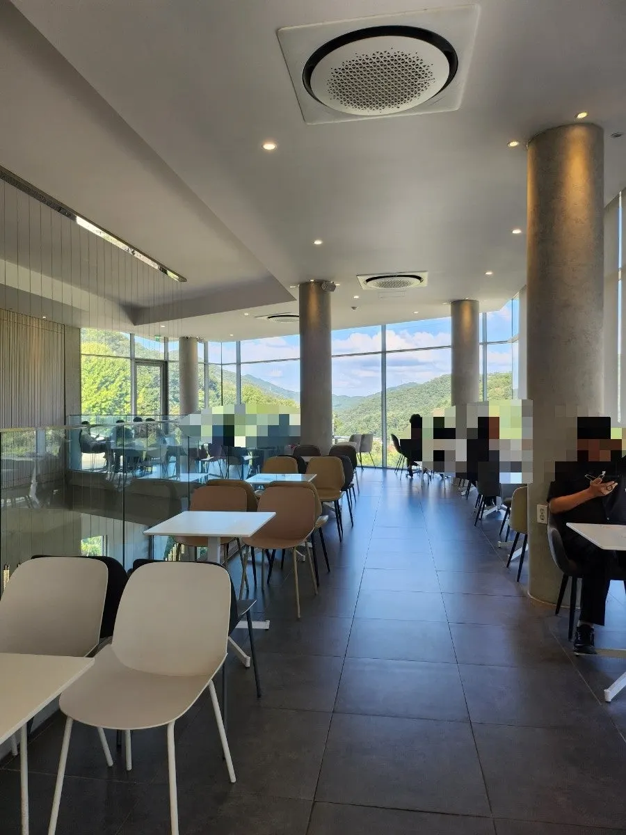 High-ceilinged seating area on the main building's first floor