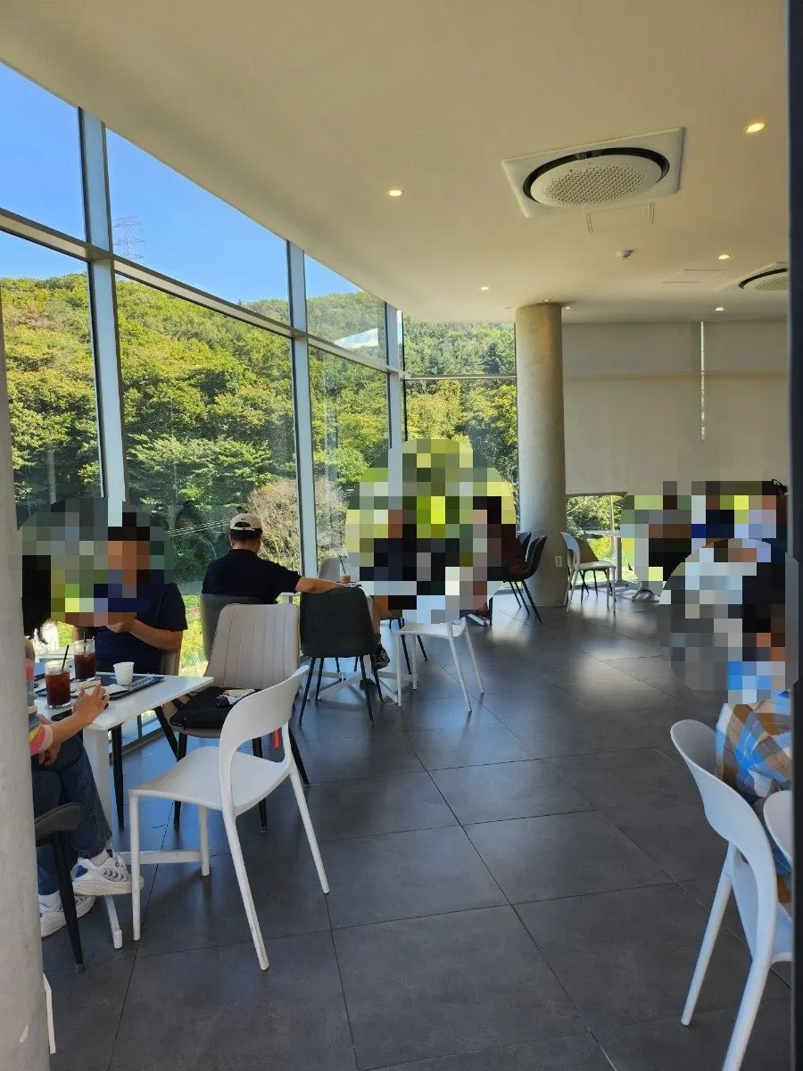 Wide table seating on the main building's second floor