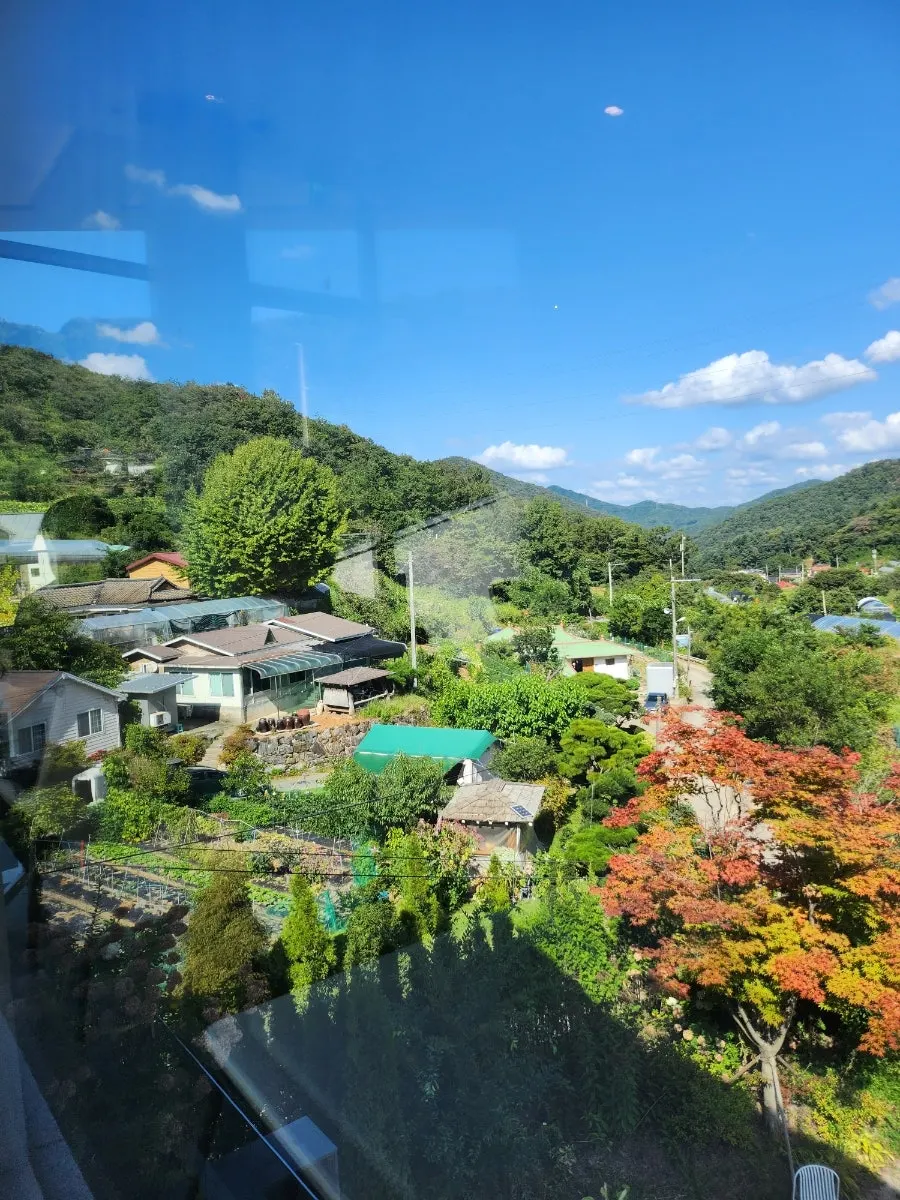 Countryside view through the second-floor picture windows