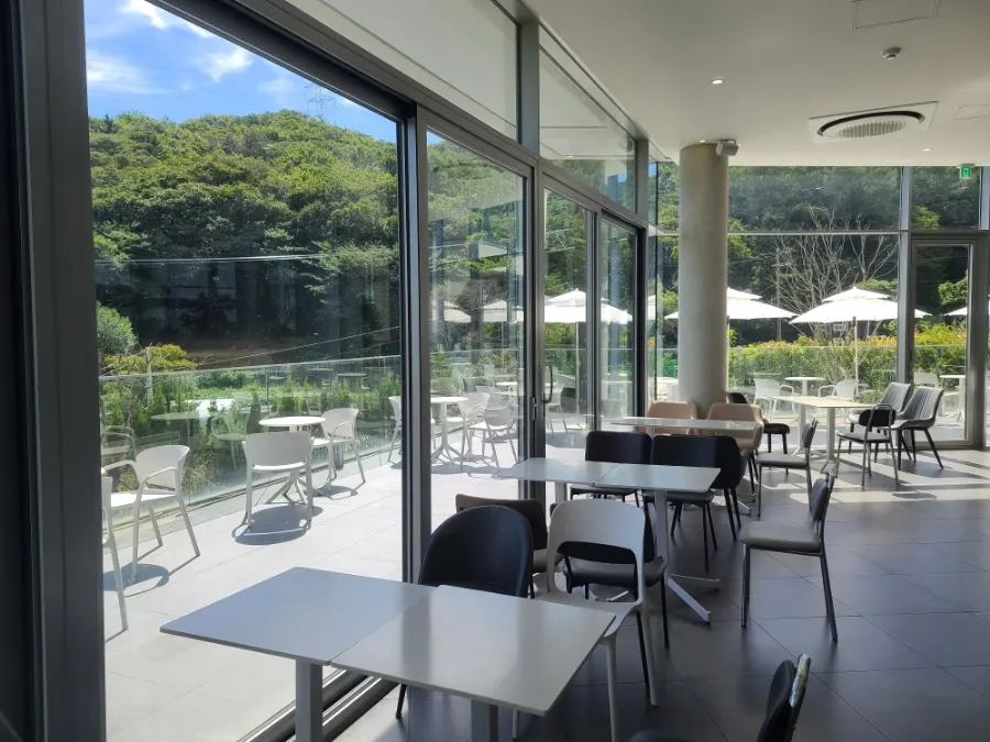 High-ceilinged first-floor seating at Café Sum