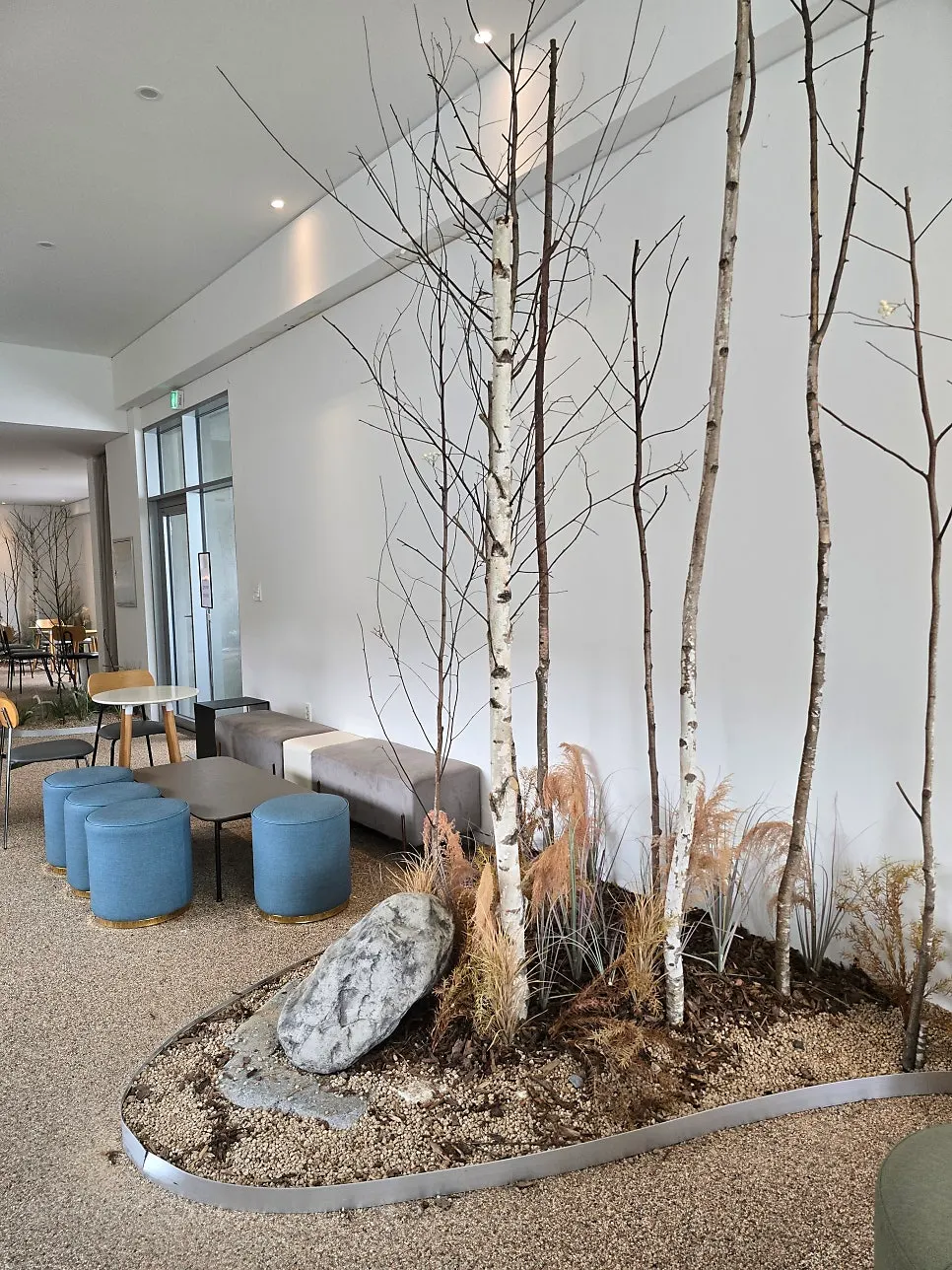 Spacious interior of Sum with floor-to-ceiling windows