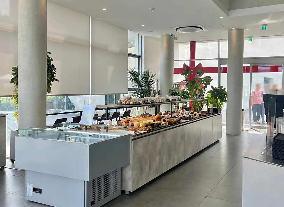 Sum's bakery display cases lined up from the entrance