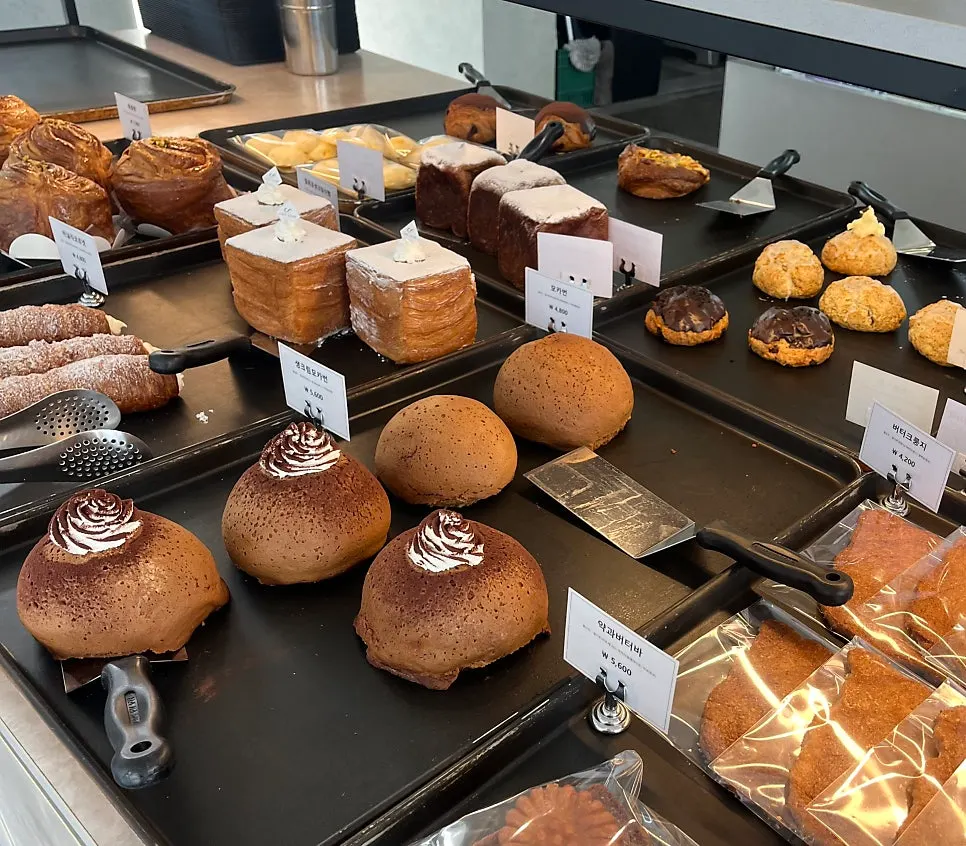A display case with old-school breads like mammoth bread