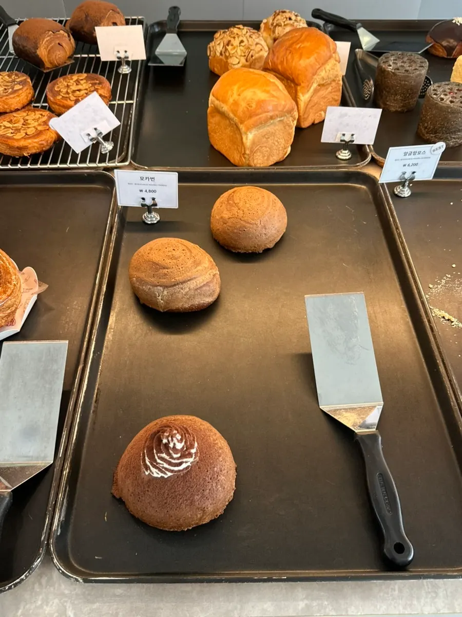 Sweet dessert breads on display at Sum