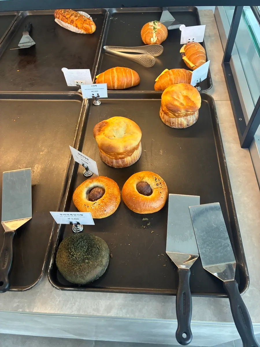 Wrapped baked goods and pound cakes on display