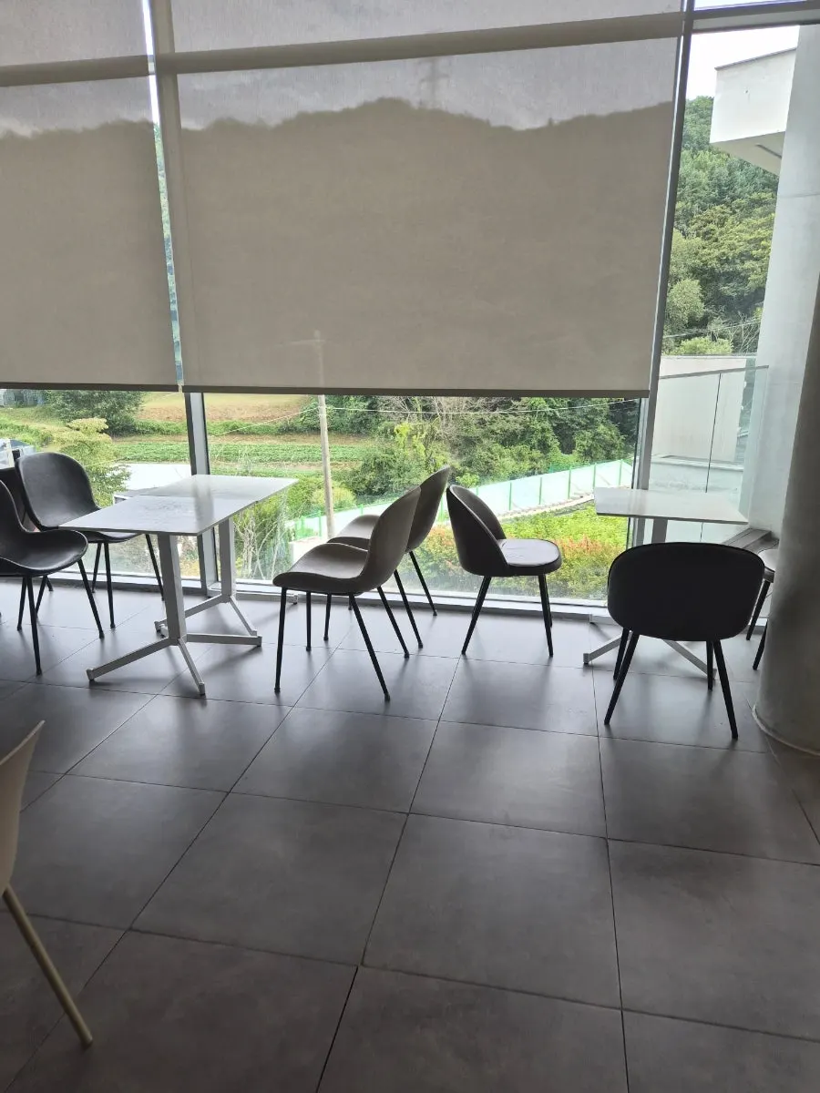 The high-ceilinged, double-height interior of Sum's main building