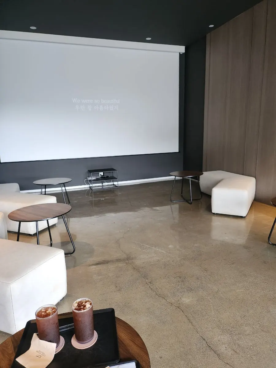 The large screen in the music listening room on the 1st floor of Sum's annex