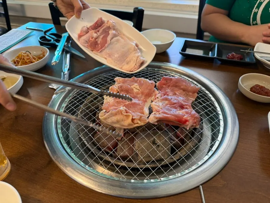 Dakgalbi cooking on the charcoal grill plate