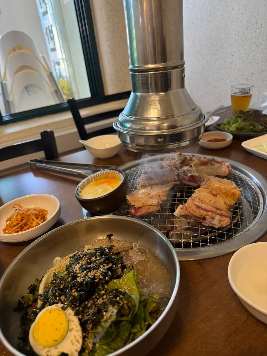 A bite of mixed bibim memil makguksu