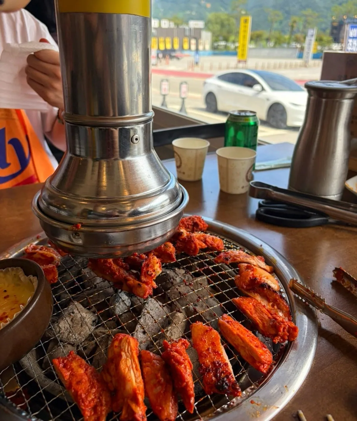 Table setting with seasoned charcoal dakgalbi for two and cheese fondue