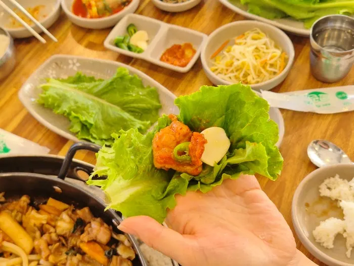 Dakgalbi wrapped in lettuce
