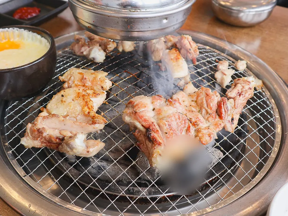Dakgalbi placed on the charcoal grill