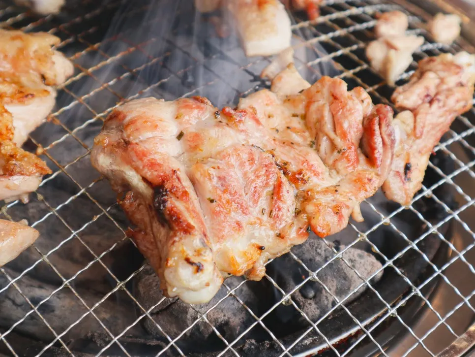 Original salt-grilled dakgalbi browning nicely on the grill