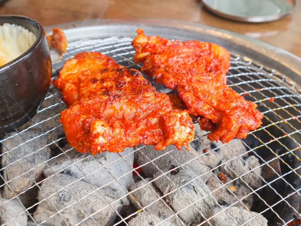 A fully cooked piece of salt-grilled dakgalbi
