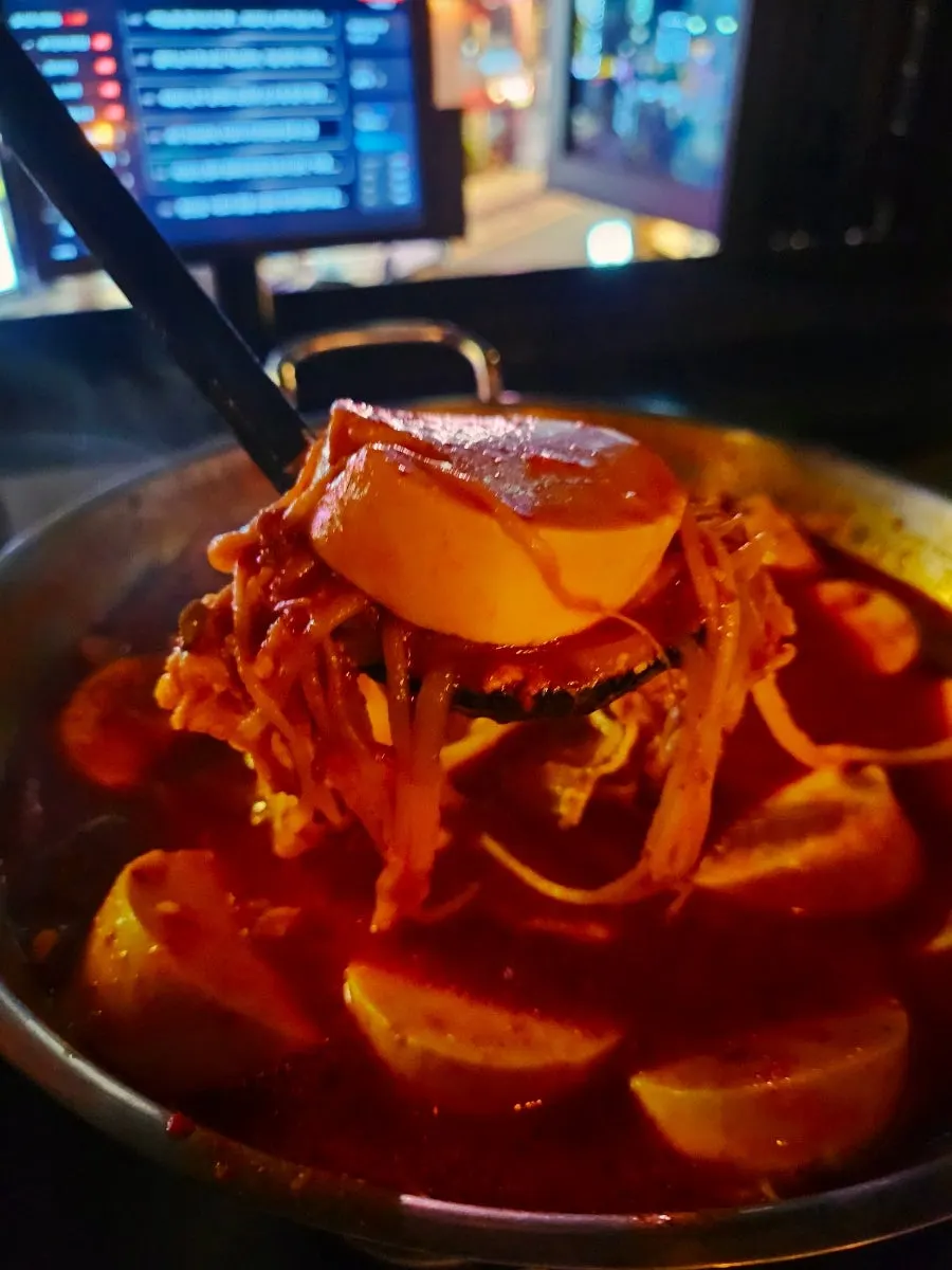 Jjapagetti with green onion kimchi as food with drinks