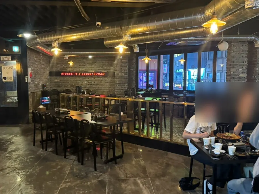 Seating area with a wood and metal frame pub atmosphere