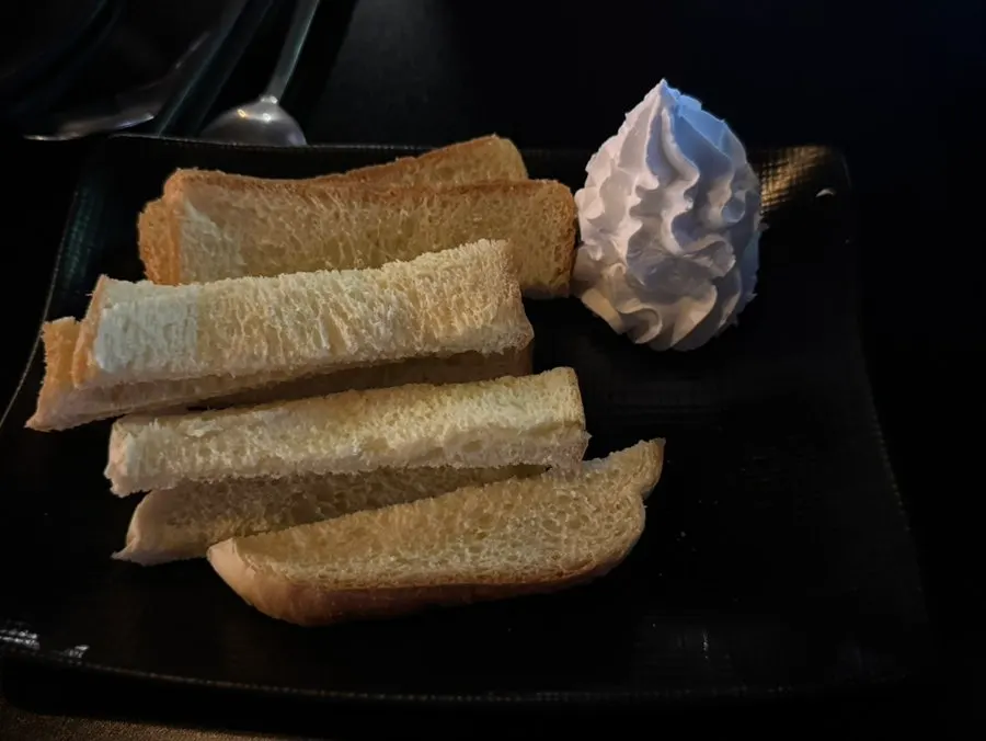 Basic toast and whipped cream served as anju