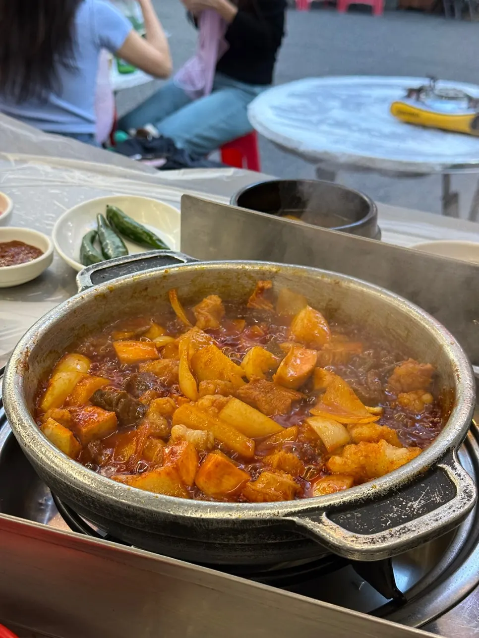 Seasoned yang gopchang served with side dishes
