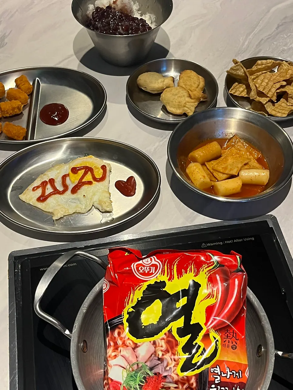 Basic side dishes laid out on the room table