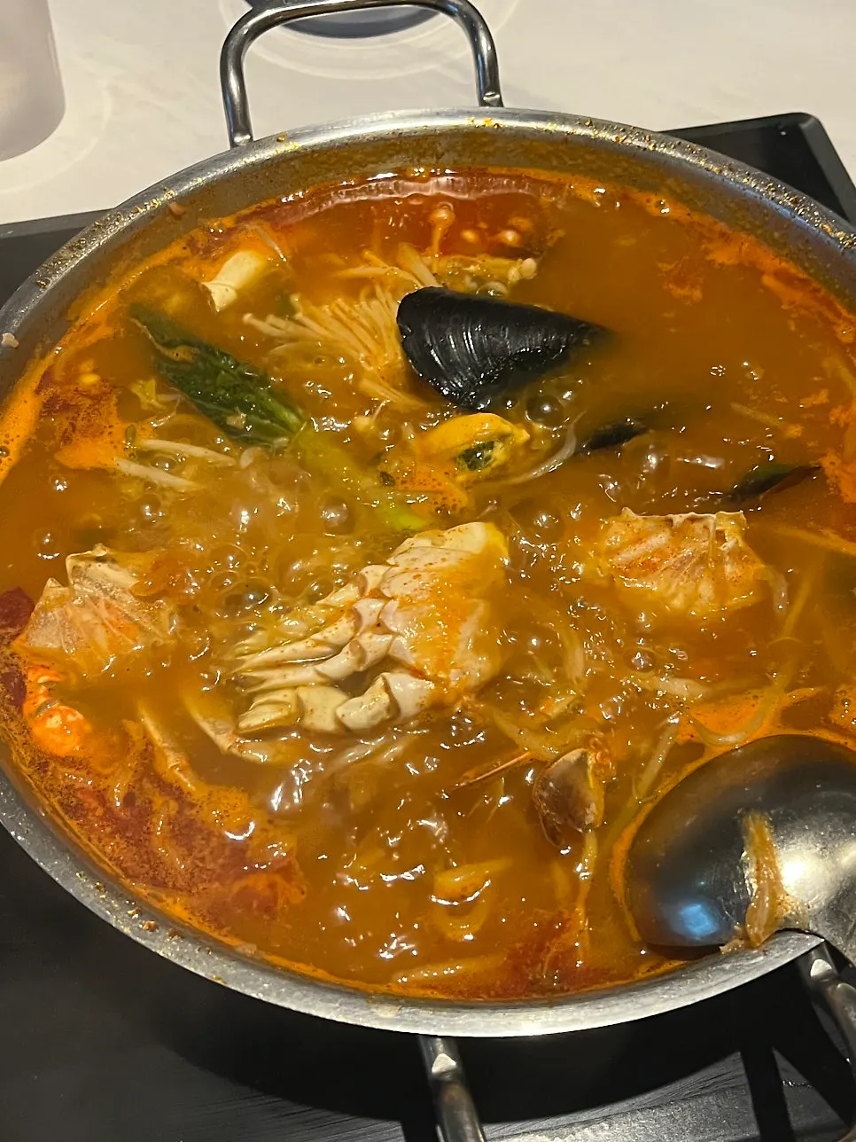 Seafood jjamppong set on the table under room lighting