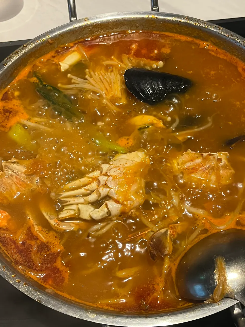 Seafood jjamppong broth with crab and mussels