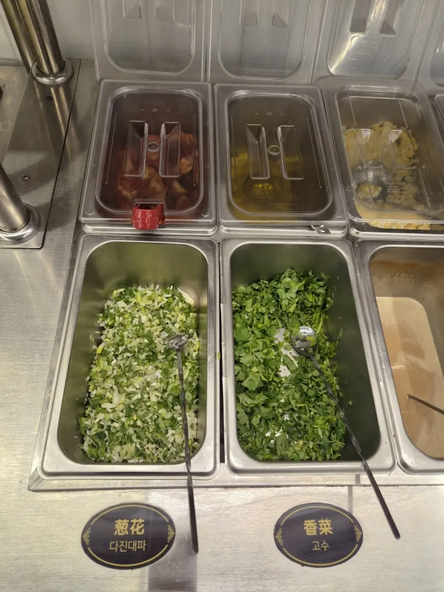Sauce ingredient corner with scallions and peanut sauce
