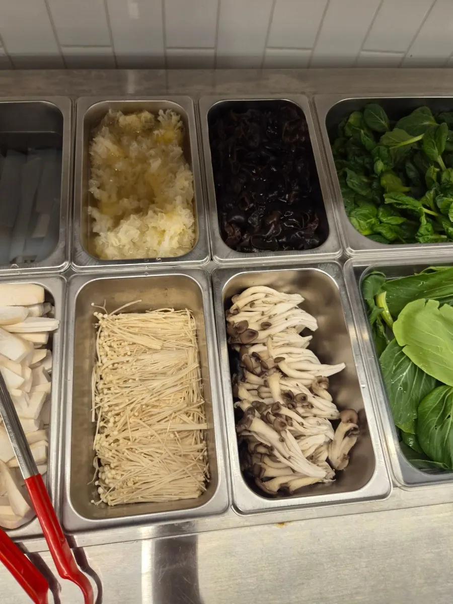 Hotpot ingredient stand with panda rice cakes, bunmoja, and quail eggs